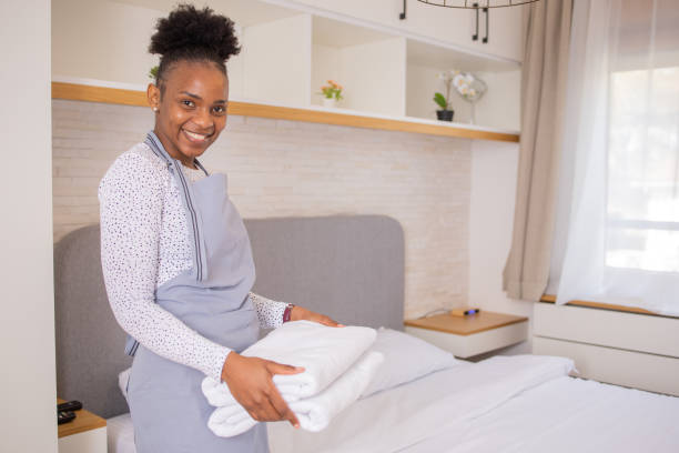 istock Housekeeper is making the bed in the hotel 1751324086
