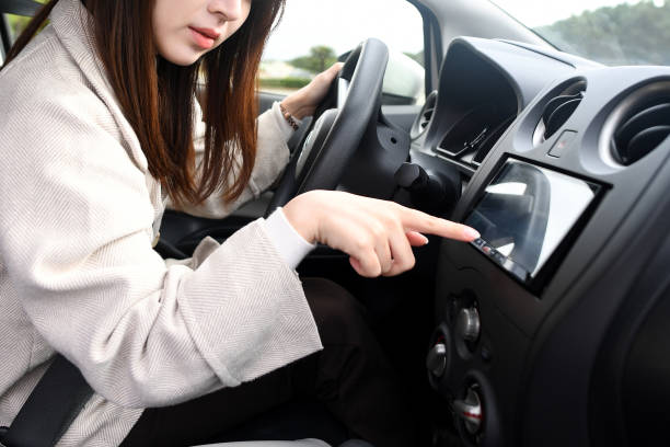 istock Asian young woman using car navigation system with troubled face while driving 1751326255