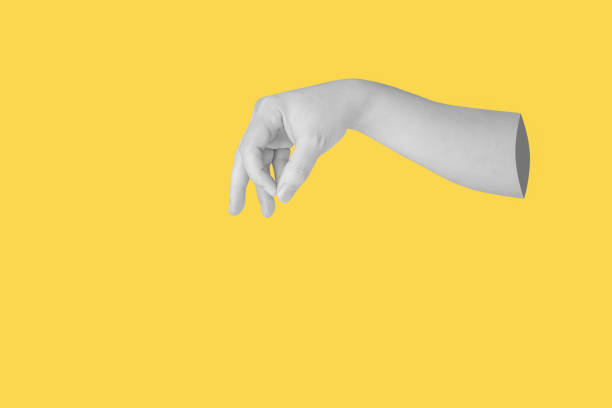 istock Woman hand gesture holding something isolated on yellow background 1751330780
