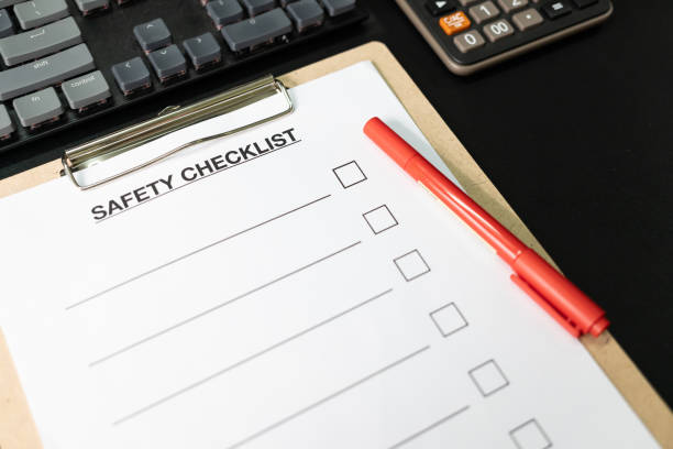 istock Blank checklist paper during safety audit and risk verification. safety checklist form on the desk with red pen. 1751342956