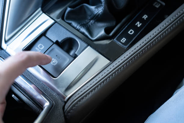 istock Finger push/pull the Electric electronic Parking Brake with Auto-hold on modern vehicle. 1751342994