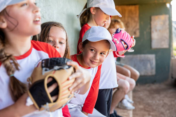 istock Enthusiastic children in the dugout share laughs during the baseball match 1751346354