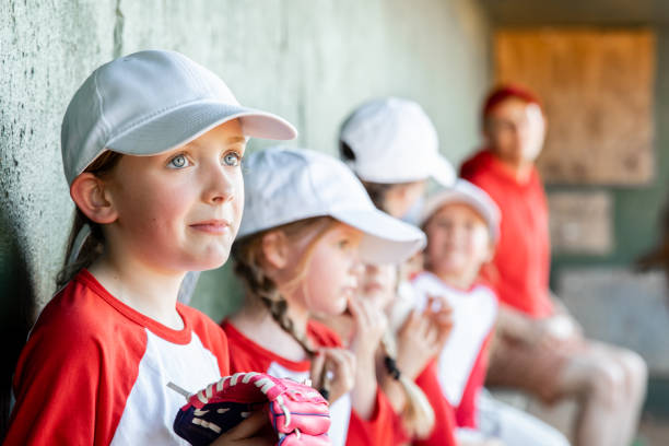 istock Elementary-aged children who are participating in co-ed Little League baseball 1751346377