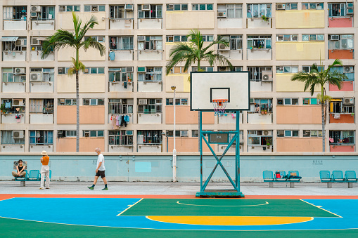 Hong Kong - September 15, 2023 : Choi Hung Estate rainbow apartment building and colorful basketball court