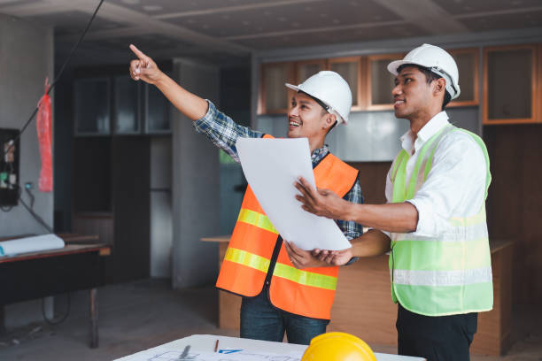 istock Two young Asian engineer visit the construction site, consult and work on site. 1751348527
