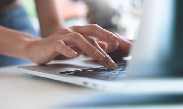 istock Closeup, business woman hands working and typing on laptop computer keyboard on office table , online working, surfing the internet, social media, global network 1751383298