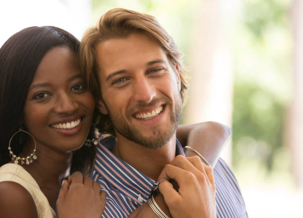 istock Smiling couple hugging indoors 175138720