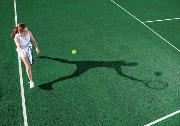 istock Tennis player casting shadow on court 175139059