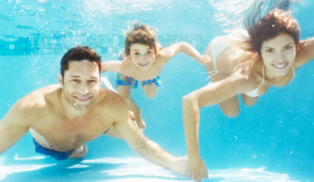 istock Family swimming in pool 175139104