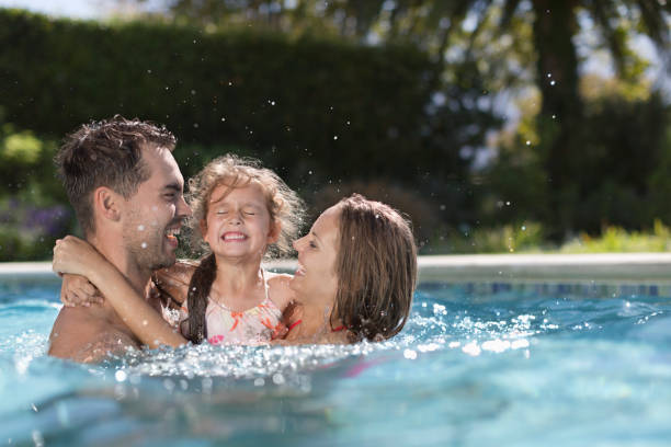 istock Family playing in swimming pool 175139121