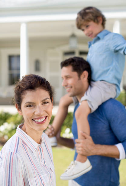 istock Family smiling outside house 175139220