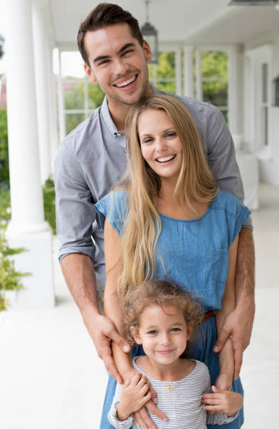 istock Family smiling together on porch 175139225