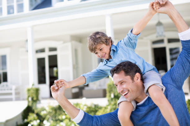 istock Father and son playing outside house 175139246