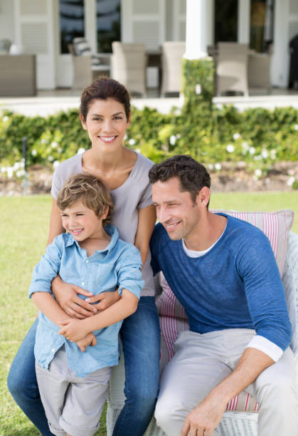 istock Family smiling outside house 175139251