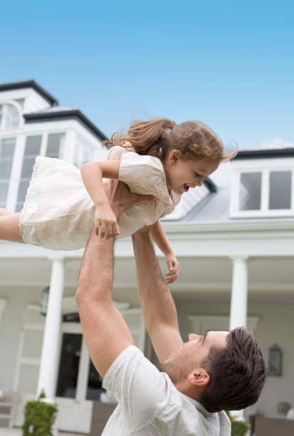 istock Father and daughter playing outdoors 175139258