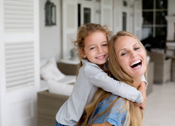 istock Mother and daughter playing on porch 175139264