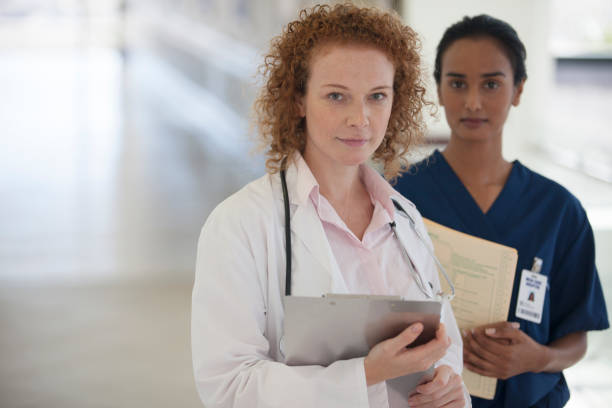 istock Doctor and nurse standing in hallway 175139303