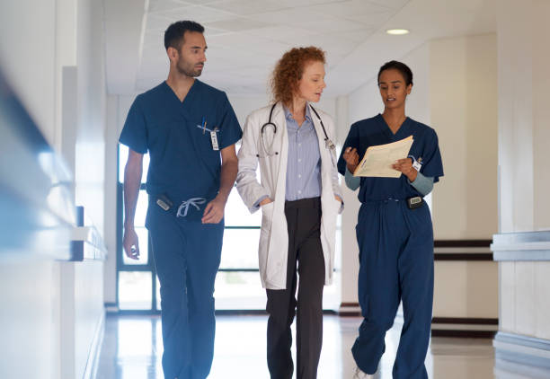 istock Hospital staff talking in hallway 175139339