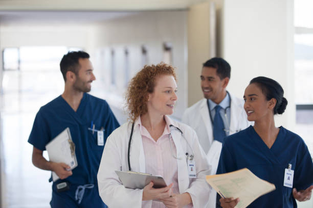 istock Hospital staff talking in hallway 175139383