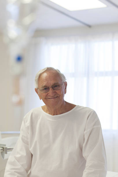 istock Older patient smiling in hospital room 175139397