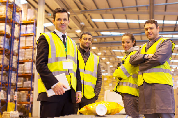 istock Businessman and workers smiling in warehouse 175139504