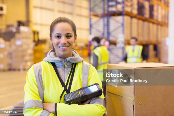 Worker Holding Scanner In Warehouse Stock Photo - Download Image Now - Warehouse, Freight Transportation, Bar Code Reader