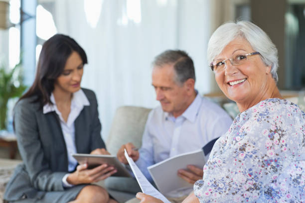 istock Financial advisor talking to couple on sofa 175139915