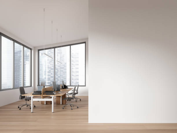 istock Modern coworking interior with pc computer and chairs, window. Mock up wall 1751399534
