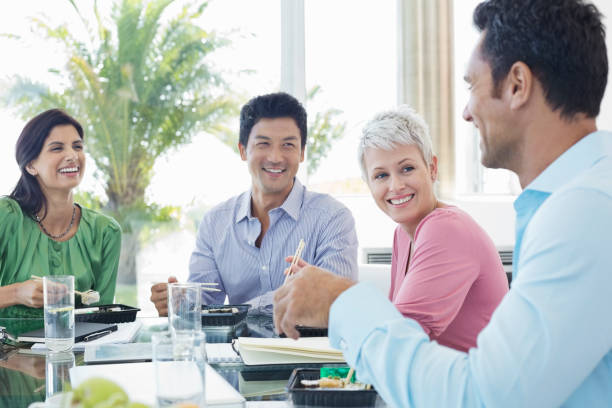 istock Business people smiling in lunch meeting 175139988