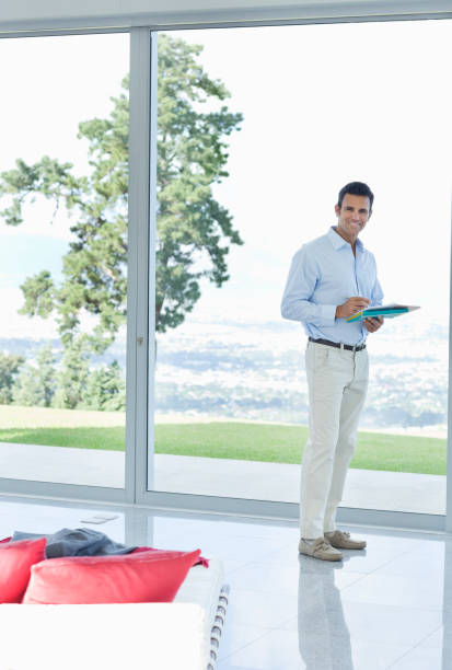 istock Businessman reading papers in office 175140027