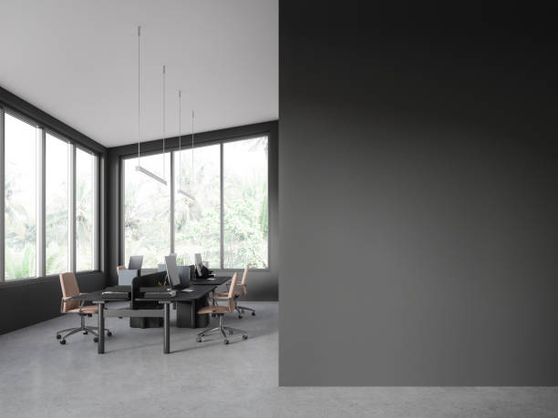 istock Grey office interior with pc computer and desk near window. Mock up wall 1751401178