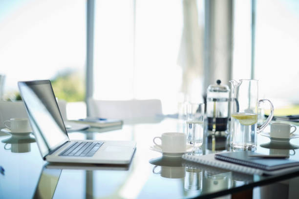 istock Laptop, coffee cups and notebooks on desk 175140124