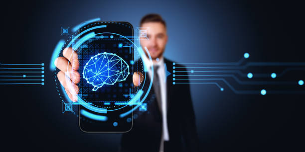 istock Businessman holding a smartphone with digital AI brain hologram, technologies 1751405416