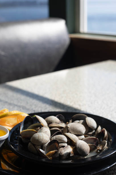 Steamed Clams with lemon stock photo