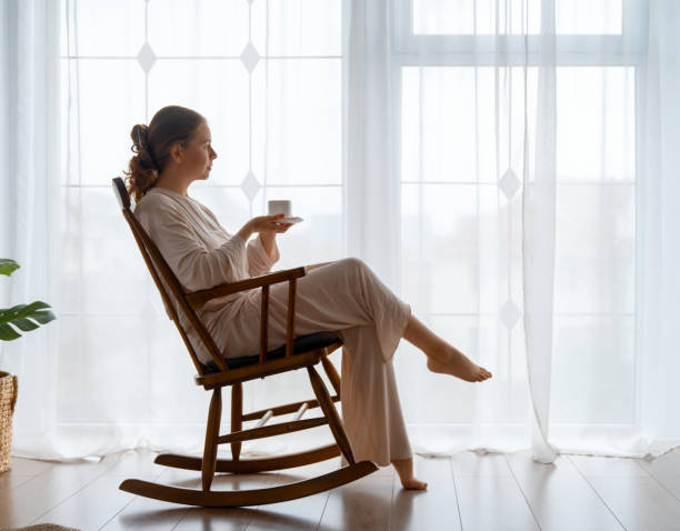 istock woman resting on armchair at home 1751467023