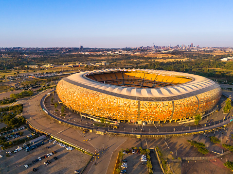 FNB Stadium also known as Soccer City situated west of Johannesburg city centre seen here at sunset before the beginning of an evening match between Kaiser Chiefs and Amazulu.