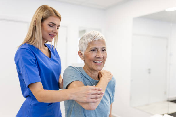 istock Professional therapists is stretching muscles, senior patient with abnormal muscular symptoms, physical rehabilitation therapies and treatment of physiological disorders by physiotherapists concept. 1751540285
