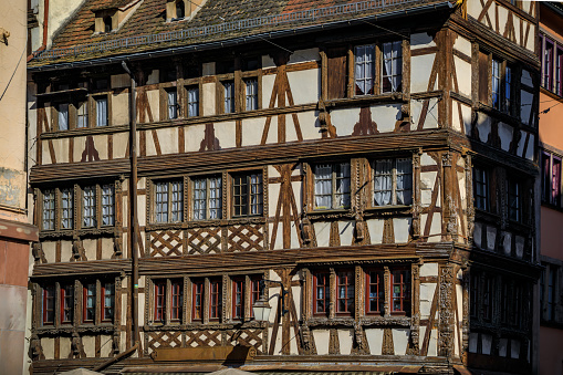 Ornate traditional half timbered houses with steep roofs in the old town of Grande Ile, the historic center of Strasbourg, Alsace, France