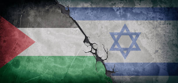 istock Deteriorated cement wall with flags of Palestine and Israel painted 1751547846