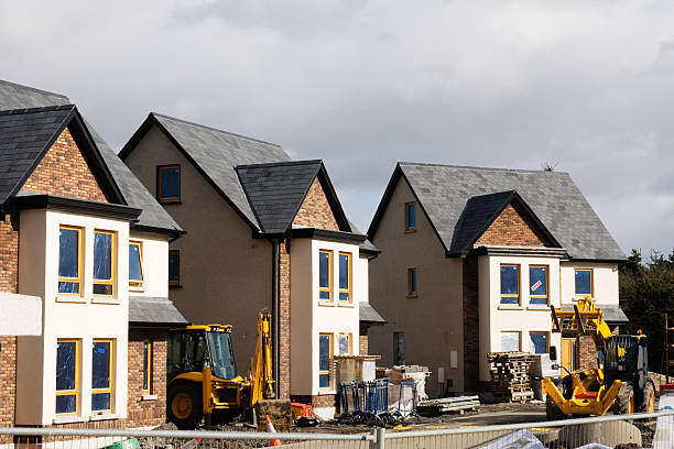 new houses new houses one with a "sold" sign houses for sale stock pictures, royalty-free photos & images
