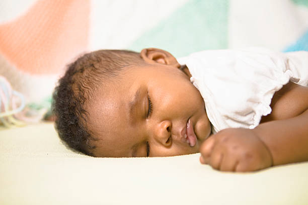 Baby girl sleeping stock photo