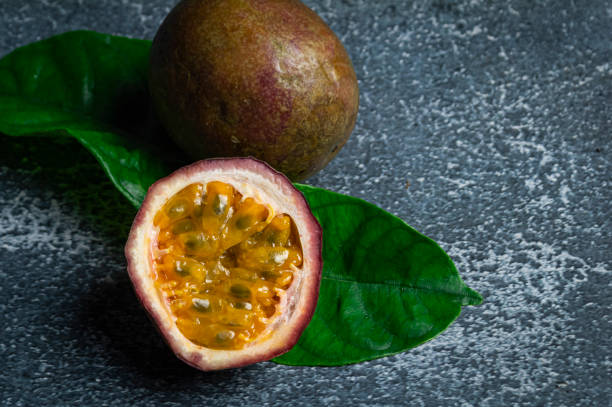 istock Passion fruit cut in half The flesh is bright yellow. 1751590874