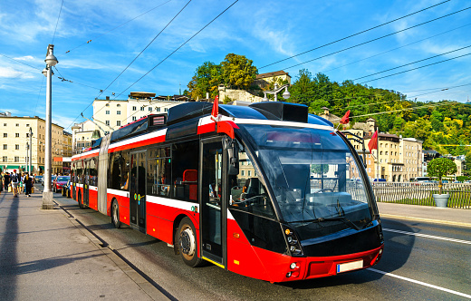 City trolleybus on a bridge across the Salzach in Salzburg, Austria