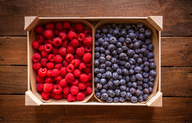 istock Wooden crate filled with blueberries and raspberries 1751612298