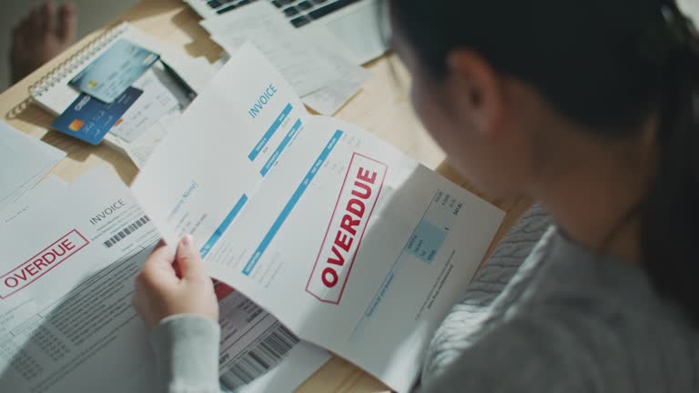 Woman looking at Debt bill past due