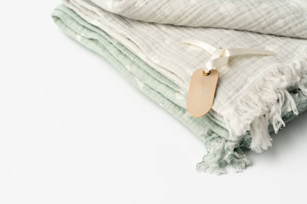 istock Warm cotton gray blanket with paper tag on white background 1751622677