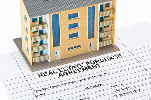 Real Estate Purchase Agreement - concept with imaginary General Urban Plan and condominium residential building model