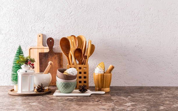 istock A set of kitchen utensils made of eco-friendly materials on a kitchen stone countertop with Christmas decorations in a minimalist style. A copy space. 1751626143