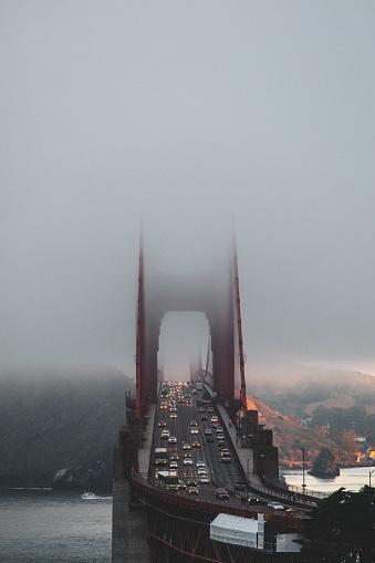San Francisco, United States – September 16, 2021: A scenic view of the Golden Gate Bridge shrouded in fog in San Francisco, California.