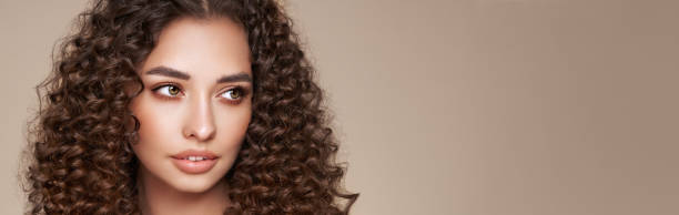 istock Beautiful smiling woman with afro curls 1751637289